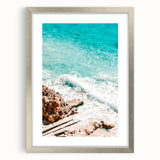 Textured art featuring abstract swirls in muted grays and blues, printed on a silver-framed canvas.