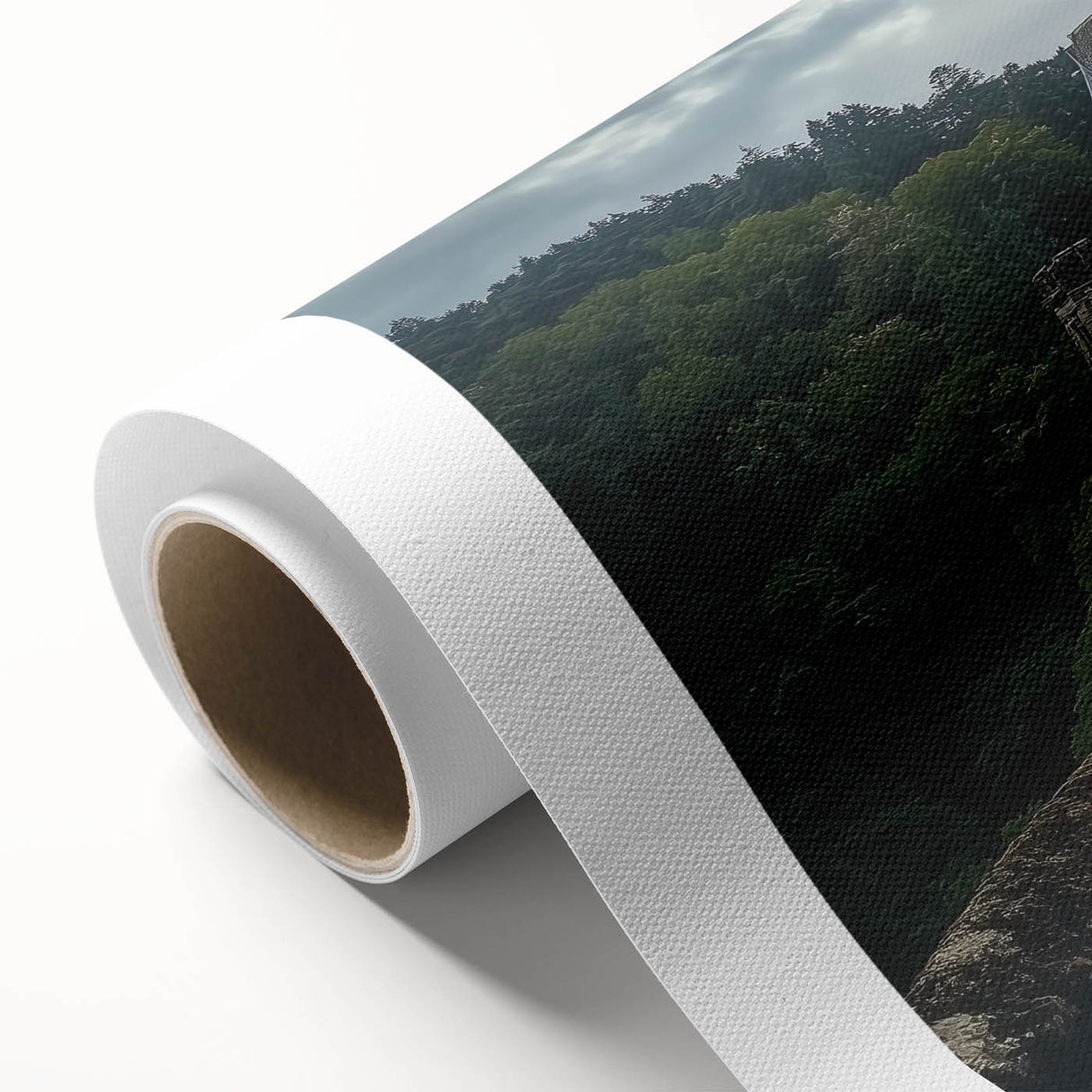 Rolled canvas artwork depicting a serene landscape with a majestic castle surrounded by lush greenery and a clear blue sky, ideal for home decor.