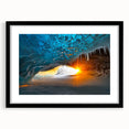 Framed black landscape artwork showcasing intricate cave formations, presented with a white mat for contrast, ideal for modern home decor in minimalist settings.