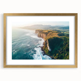 Framed landscape artwork showcasing dramatic cliffs and serene nature, featuring a gold mat border, perfect for enhancing home decor and interior aesthetics.