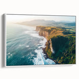 Framed canvas artwork showcasing a stunning landscape with dramatic cliffs, presented in a sleek white frame, ideal for modern home decor. Perfect for nature enthusiasts.