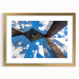 Elegant gold landscape bridge frame with a white mat, showcasing a modern design in a bright setting, perfect for home decor or office art displays.