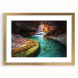 Elegant landscape artwork depicting canyons, framed with a gold mat, showcasing rich earthy tones and intricate details, perfect for home decor.