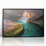 Framed acrylic wall art depicting a vibrant landscape of canyons, showcasing rich colors and intricate details, perfect for home decor enhancement and artistic expression.