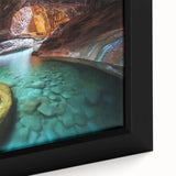 Close-up of a framed landscape canvas featuring vibrant canyons with intricate details, showcasing rich earth tones and textures, perfect for home decor.