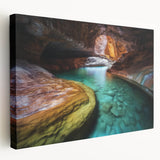 Stretched canvas artwork depicting a vibrant landscape of canyons in warm earth tones. Ideal for home decor, this piece adds a natural touch to any room.