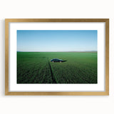 Elegant gold-framed landscape artwork showcasing serene countryside scenery with a mat border, perfect for enhancing home decor and adding a touch of sophistication.