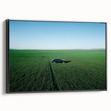 Framed canvas artwork showcasing a serene countryside landscape with vibrant greens and a tranquil sky, viewed from the side. Ideal for home decor.