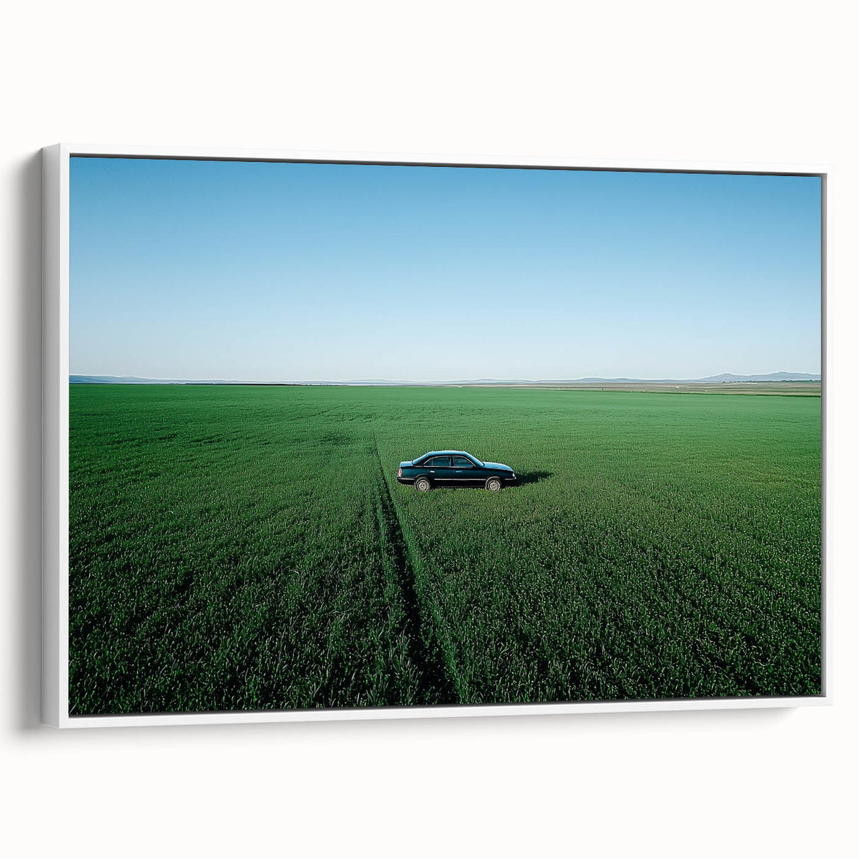 Framed canvas artwork showcasing a serene countryside landscape with rolling hills and vibrant greenery, presented in a sleek white frame, ideal for home decor.