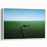 Framed canvas artwork showcasing a serene countryside landscape with rolling hills and vibrant greenery, presented in a sleek white frame, ideal for home decor.