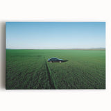 Stretched canvas artwork showcasing a serene countryside landscape with rolling hills, vibrant green fields, and a clear blue sky, perfect for home decor.