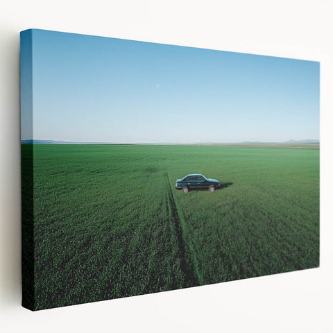 Stretched canvas artwork depicting a serene countryside landscape in vibrant colors, showcasing rolling hills and a clear blue sky, perfect for home decor.