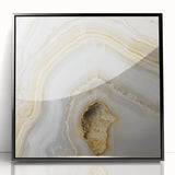 Large abstract wall art featuring swirling patterns in muted earth tones, framed in black acrylic.