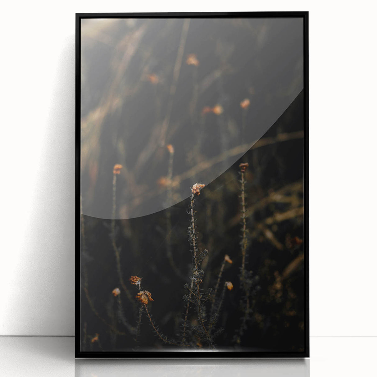 Large abstract wall art depicting autumnal trees in warm orange and red tones, framed in black acrylic.