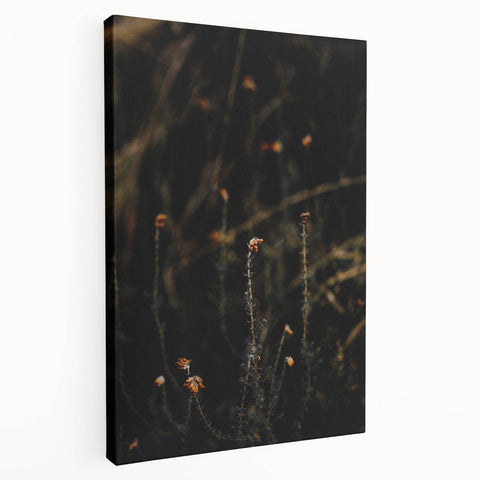 Side view of a large stretched canvas depicting a fall-themed abstract design in warm orange and red tones.