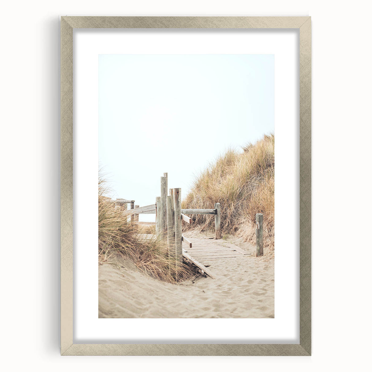 Textured abstract art print in vibrant orange and yellow tones, framed in silver, ideal for bedroom ambiance.