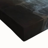 Close-up of a stretched canvas depicting a vibrant landscape with a majestic castle, showcasing rich colors and intricate details, perfect for home decor.