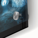 Close-up of an acrylic glass artwork depicting intricate landscapes and caves, showcasing vibrant colors and textures, ideal for home decor.