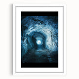 Framed landscape art print depicting a serene cave scene with natural hues, featuring a white mat and sleek wooden frame, ideal for home decor enhancement.