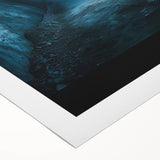 Rolled canvas artwork showcasing a vibrant landscape scene with caves, featuring rich colors and intricate details, securely packaged in a durable cardboard tube for protection.