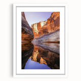 Framed landscape artwork showcasing dramatic cliffs and serene ocean views, presented in a white mat and sleek frame, ideal for enhancing modern home decor.