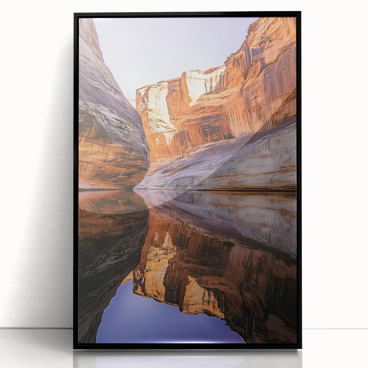 Framed acrylic artwork depicting a stunning landscape of rugged cliffs under a vibrant blue sky, presented in a sleek black frame, ideal for modern home decor.