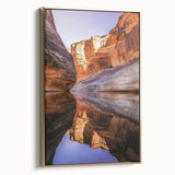 Framed canvas artwork depicting a stunning landscape of cliffs in warm tones, featuring a gold frame that enhances the overall aesthetic, ideal for home decor.