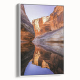 Framed canvas artwork depicting a stunning landscape with towering cliffs, showcased in a sleek white frame, ideal for modern home decor. The vibrant colors and intricate details enhance any room's aesthetic.