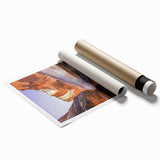 Vibrant rolled print showcasing stunning cliffs and landscapes, ideal for home decor, featuring rich colors and intricate details, packaged securely in a protective tube.