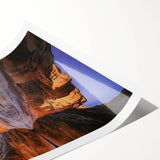 Vibrant rolled print showcasing a stunning coastal landscape with dramatic cliffs and turquoise waves, ideal for home decor or art enthusiasts.