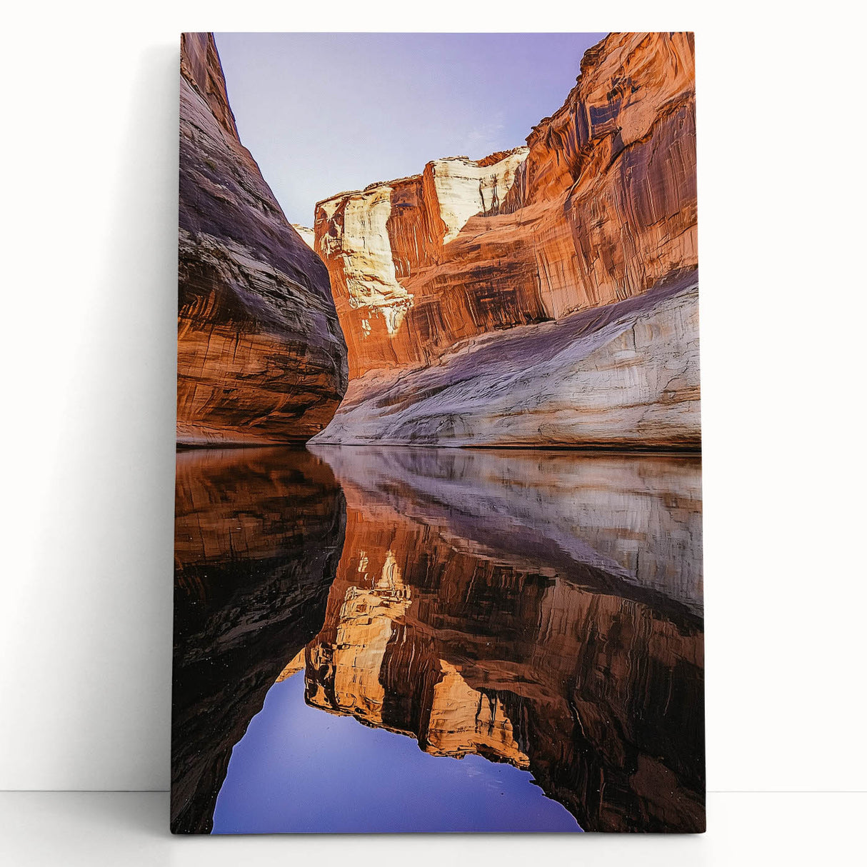 Stretched canvas artwork depicting a vibrant landscape of cliffs with dynamic colors, leaning against a textured wall, perfect for home decor and art enthusiasts.