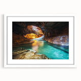 Framed landscape artwork showcasing vibrant canyons with a white mat, perfect for home decor. This eye-catching piece adds depth and color to any room.