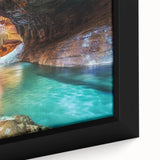 Close-up of a beautifully framed landscape canvas depicting vibrant canyons at sunset, showcasing rich colors and intricate details, perfect for home decor.