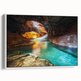 Framed canvas artwork showcasing a stunning landscape of canyons, featuring vibrant colors and intricate details, displayed from a side view against a white background.
