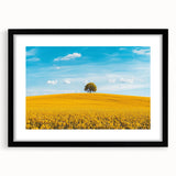 Black-framed landscape print showcasing a serene countryside scene with rolling hills and lush greenery, elegantly matted for a sophisticated display.