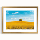 Elegant gold-framed landscape artwork showcasing a serene countryside scene with vibrant colors and detailed matting, perfect for home decor or art enthusiasts.