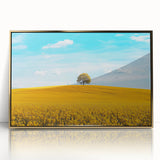Framed acrylic artwork depicting a serene countryside landscape with lush green fields and a golden frame, ideal for enhancing home decor in living spaces.