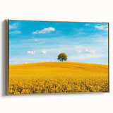 Framed canvas artwork showcasing a serene countryside landscape with vibrant colors, elegantly bordered in gold. Perfect for enhancing home decor with a touch of nature.