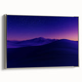 Framed canvas artwork showcasing a vibrant desert landscape, featuring warm hues of orange and gold, with a sleek silver frame that enhances its elegance. Perfect for modern home decor, this piece adds a touch of tranquility and adventure to any space.