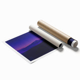 Desert landscape rolled print showcasing vibrant hues of orange and yellow under a clear blue sky, elegantly packaged in a protective tube for shipping.