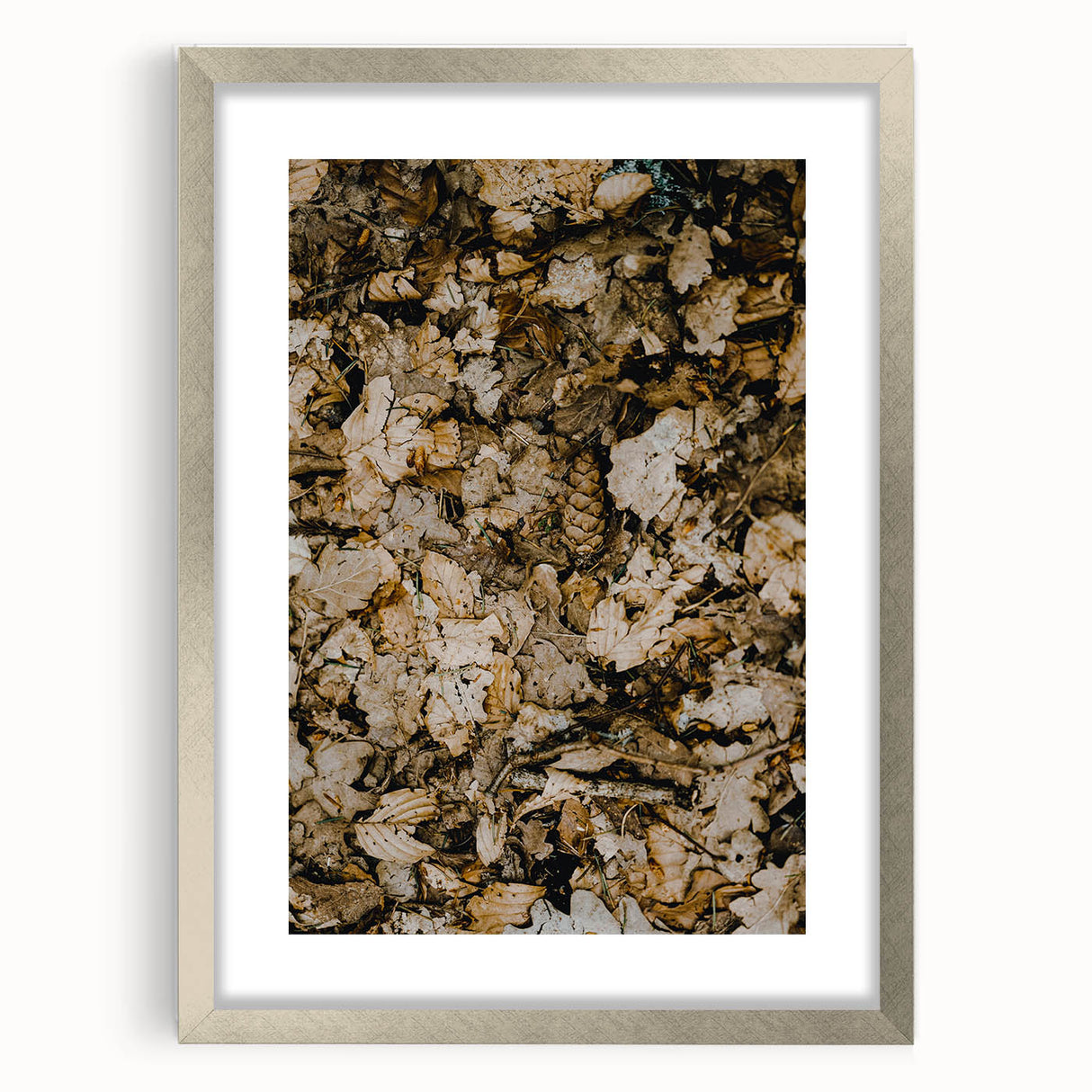Textured abstract art print in earthy orange and brown tones, framed in silver, ideal for bedroom decor.