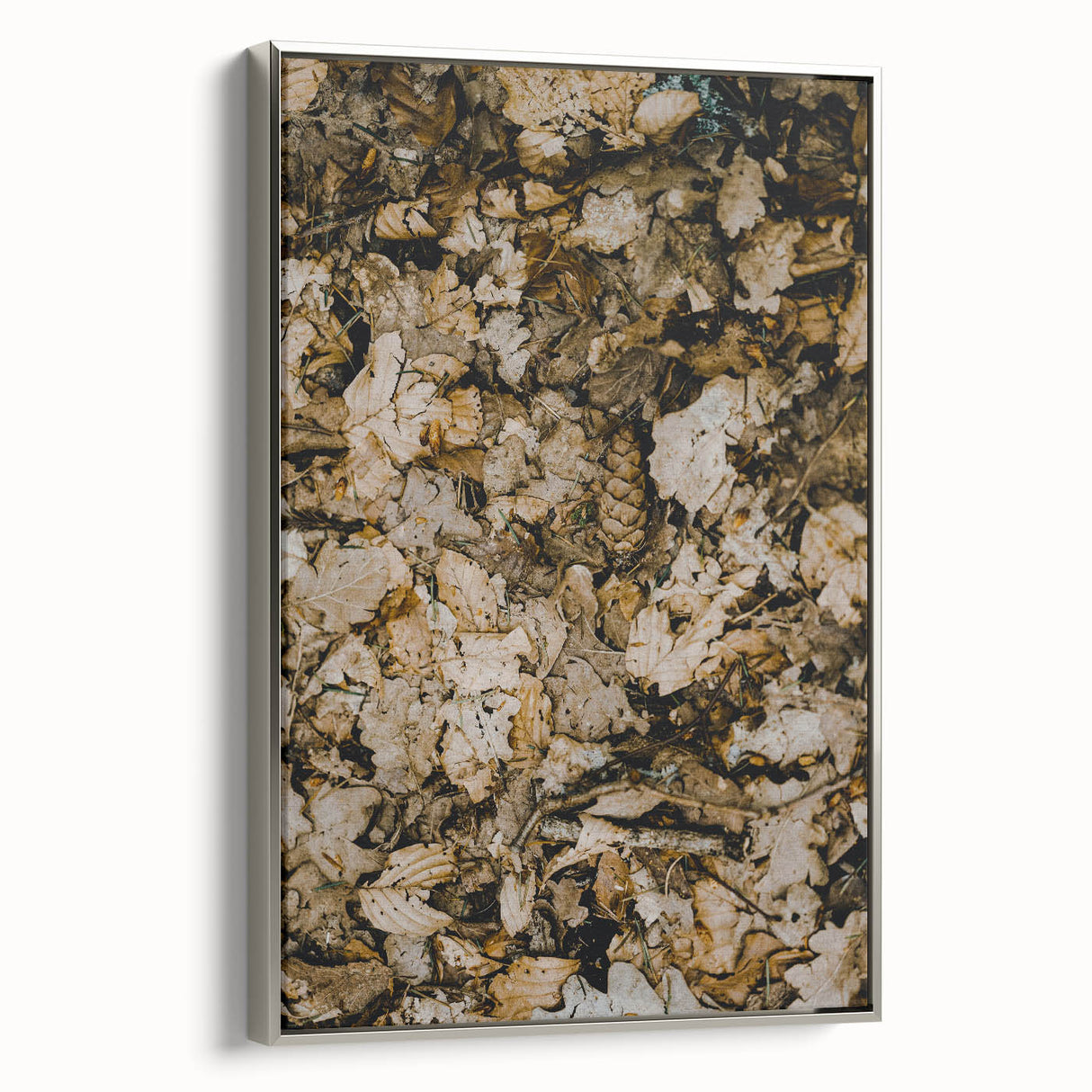 Framed canvas of a vintage landscape painting featuring fall trees in muted orange and brown tones.