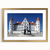 Elegant gold-framed landscape artwork depicting a picturesque castle scene, complete with a mat for added depth, ideal for enhancing home decor.
