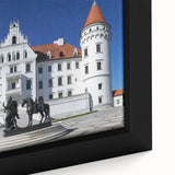 Close-up of a beautifully framed canvas showcasing a vibrant landscape painting of a majestic castle, featuring lush greenery and a clear blue sky, perfect for home decor.