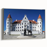Framed canvas artwork showcasing a picturesque landscape with a castle, featuring a silver frame and side profile view, ideal for home decor or gallery display.