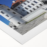 Rolled canvas artwork showcasing a stunning landscape with a medieval castle set against a vibrant sunset, expertly packaged in a durable cardboard tube for safe shipping.