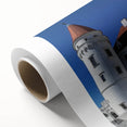 Rolled canvas artwork showcasing a vibrant landscape with a majestic castle under a blue sky, presented in a protective cardboard tube. Perfect for home decor.