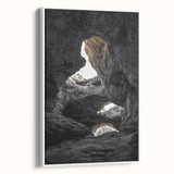 Framed canvas artwork featuring a serene landscape of caves, displayed in a modern white frame. Ideal for home decor, the piece adds a tranquil touch to any interior.