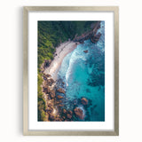 Framed landscape artwork showcasing dramatic cliffs in muted tones, accented by a silver mat and frame, perfect for enhancing modern home decor.