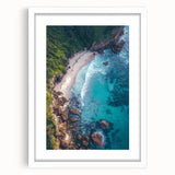 Framed landscape artwork showcasing dramatic cliffs in vibrant hues, set with a white mat for an elegant presentation, perfect for home decor accentuation.